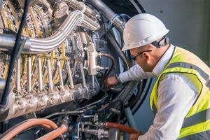 a technician inspects equipment