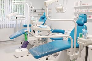 a modern dental room with two medical chairs