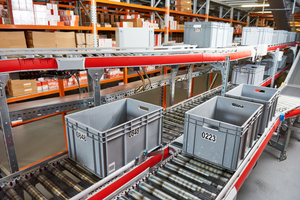 boxes with spare parts moving on conveyer in an automated warehouse