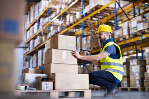 male warehouse worker with barcode scanner